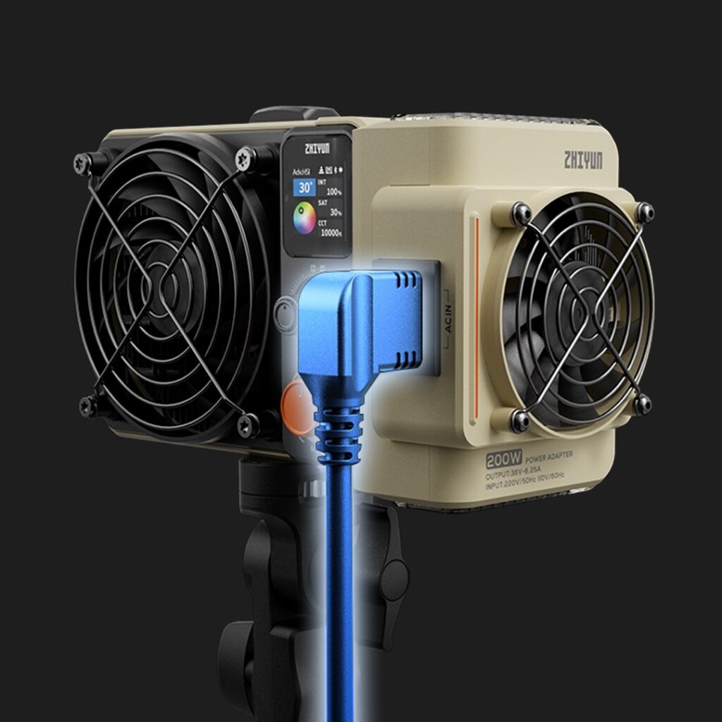 Close-up of the compact Zhiyun 200W RGB LED Monolight showing the dual fan cooling system and power adapter details
