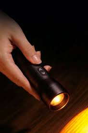 SmallRig RF 05B portable LED light held by hand, demonstrating its compact