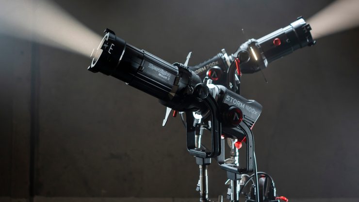 Aputure Spotlight Mount II attached to a Storm 400x LED, projecting a sharp, focused beam of hard light in a studio
