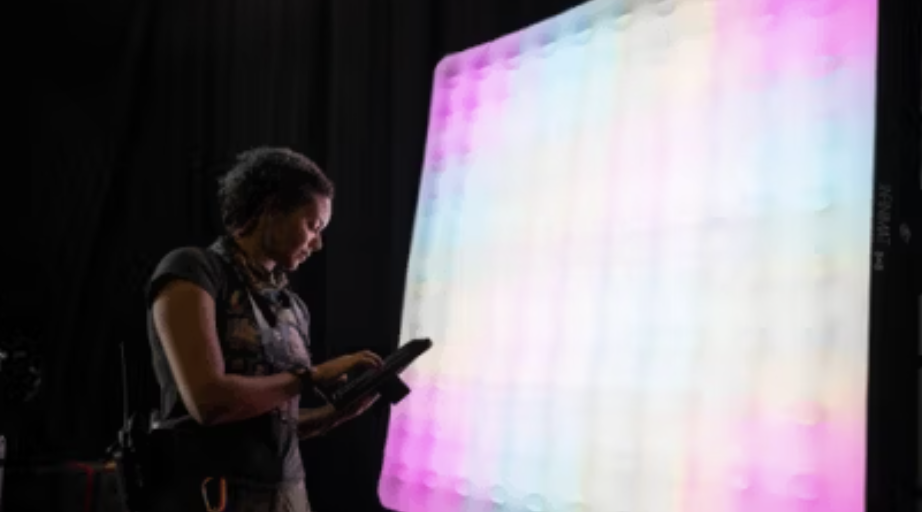 Aputure INFINIMAT inflatable LED mats displaying multi-color pixel mapping and lighting effects on a professional production stage